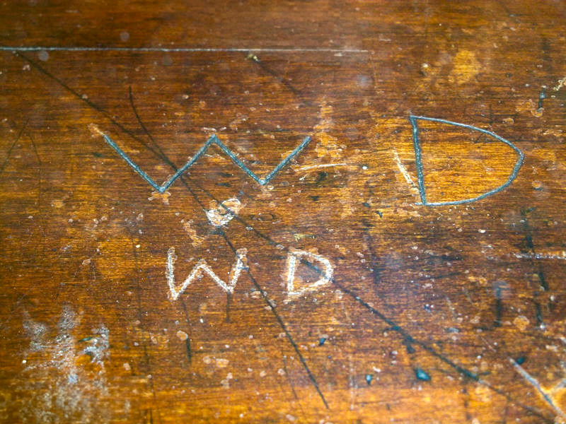 Walt Disney's initials carved in his Park School desk | Walt Statue Project